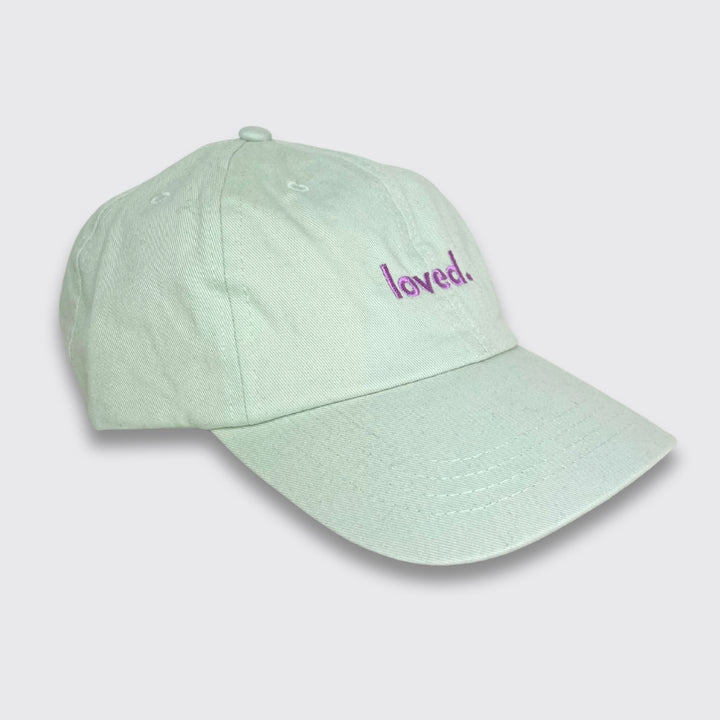 Cap "loved." Stick